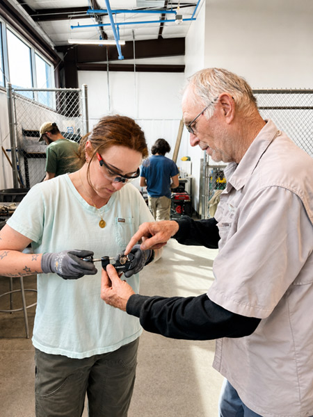 Students practicing plumbing skills in the Skilled Trades Center