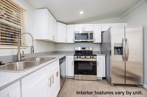Compact kitchen and living area inside a student housing unit