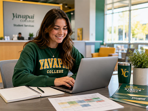 Yavapai College student using a laptop to register for classes