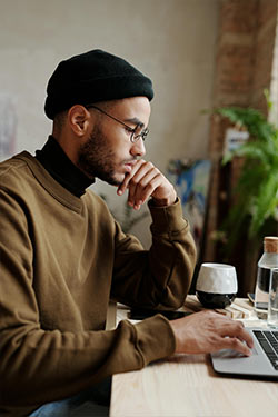 man with a stack of books